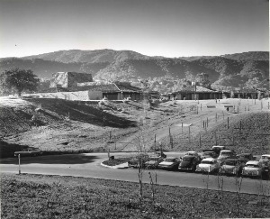 Foothill College Campus 19XX View of parking area with campus center and Los Altos HIlls in the background