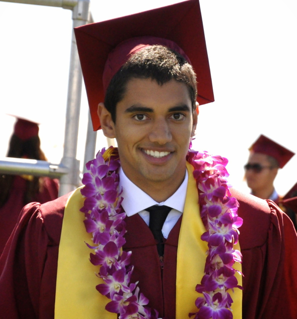 Smiling De Anza College graduate